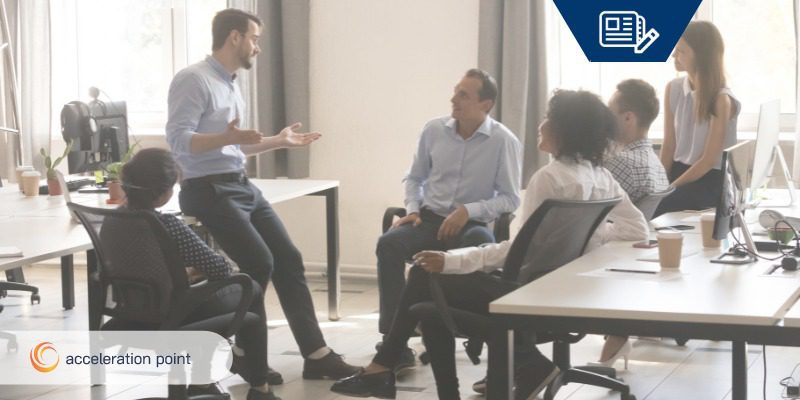 employees having team meeting